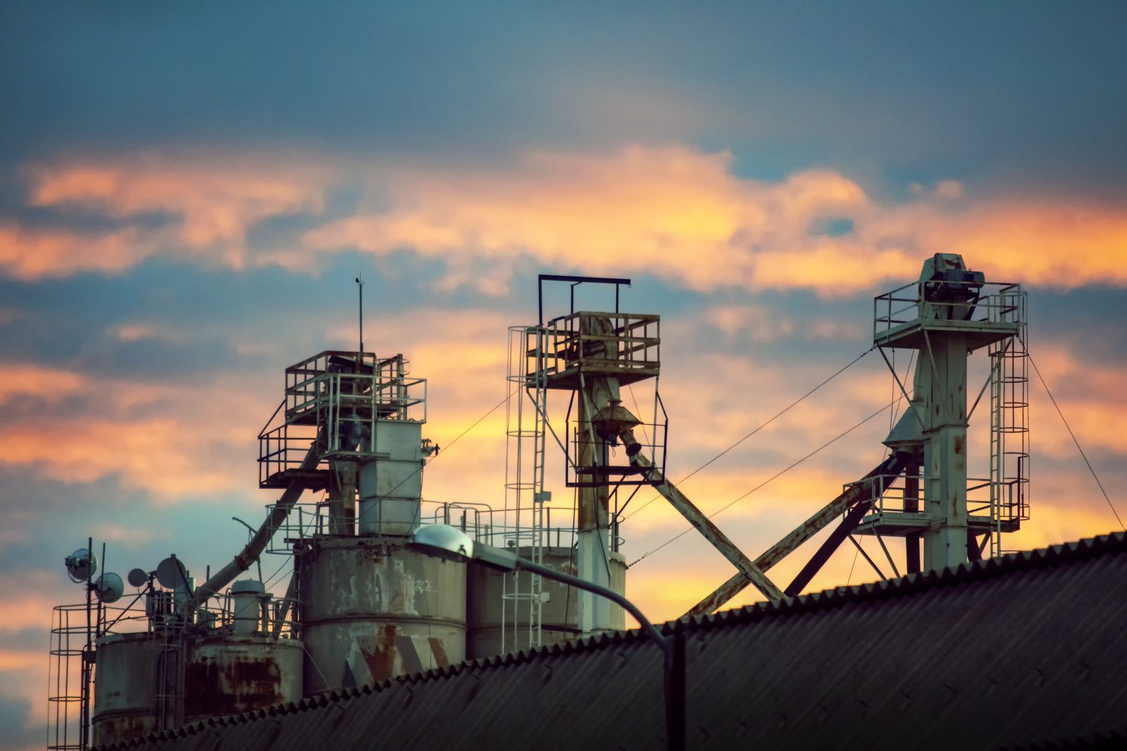 Storage tanks at sunset